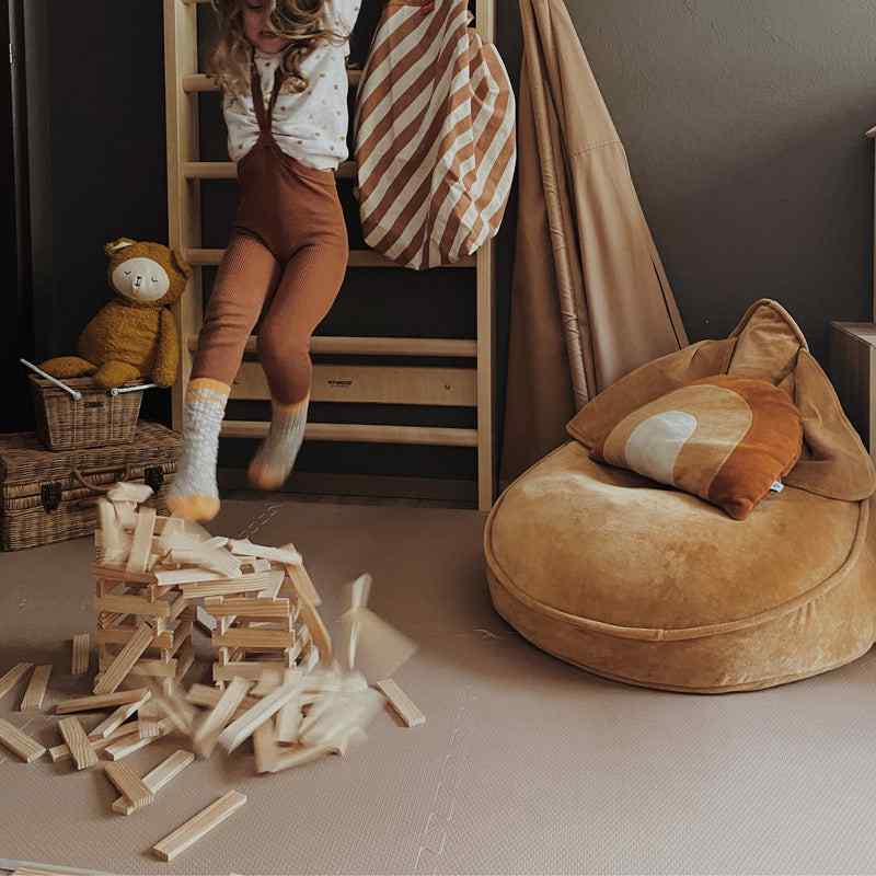 Eeveve Cinnamon Double Sided Play Mat in a playroom