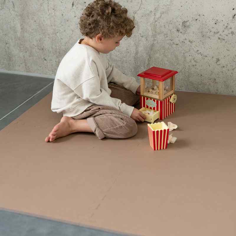 Eeveve Cinnamon Double Sided Play Mat with a toddler playing 