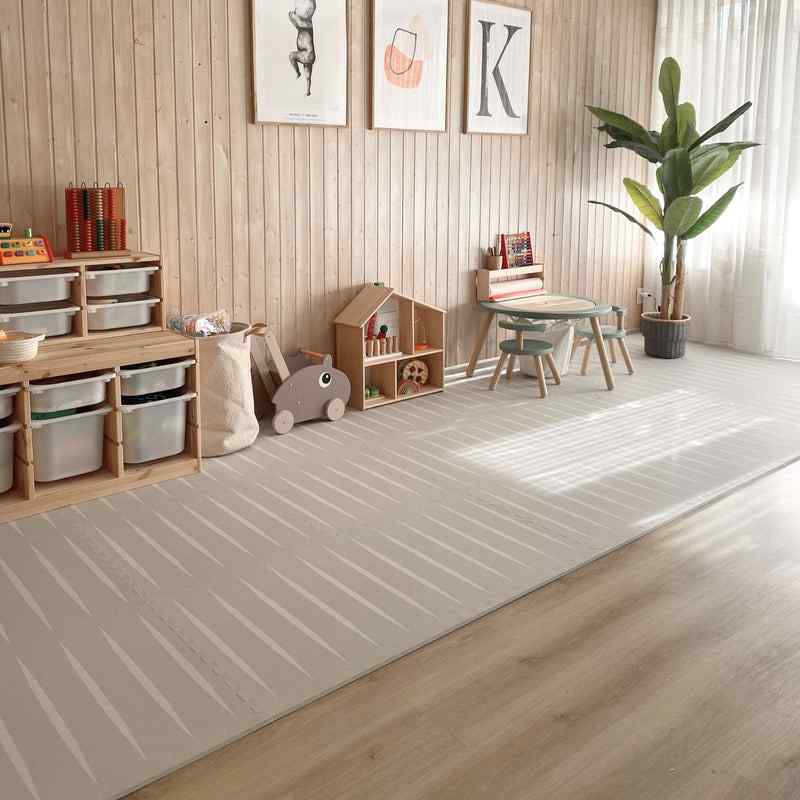 eeveve lucio linen double sided play mat in a playroom