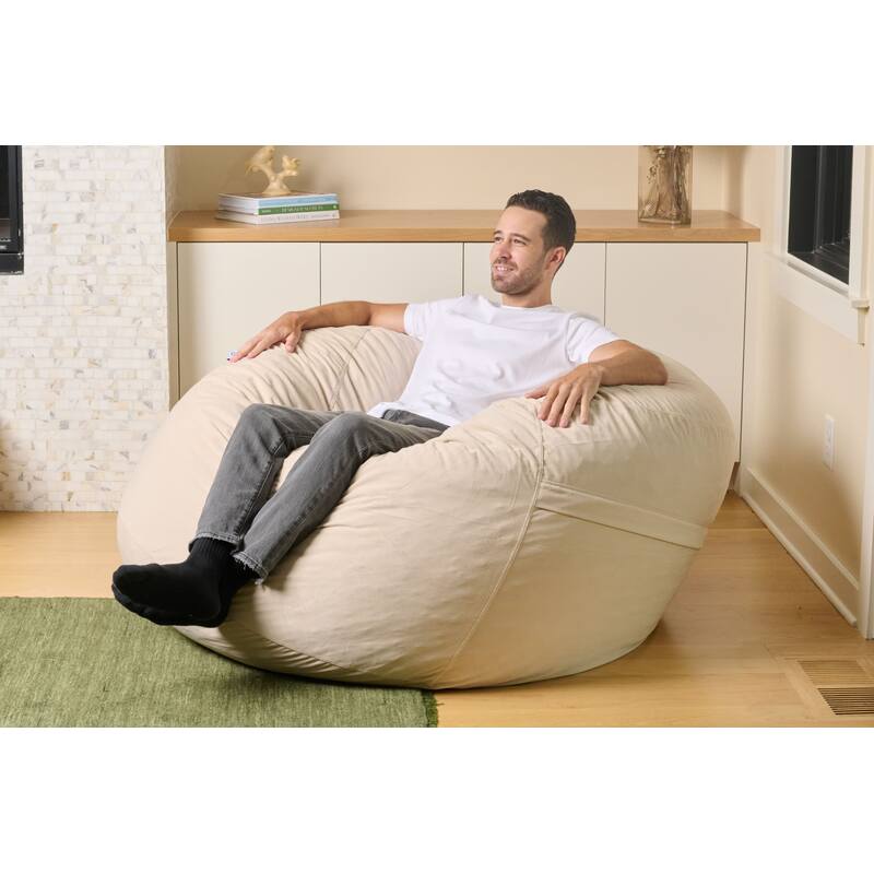 Cloud Comfort Bean Bag (Standard) – adult reclining on a Tan chair