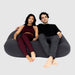 Double Moon Pod – two adults sharing the Cosmic Ash lounge seat