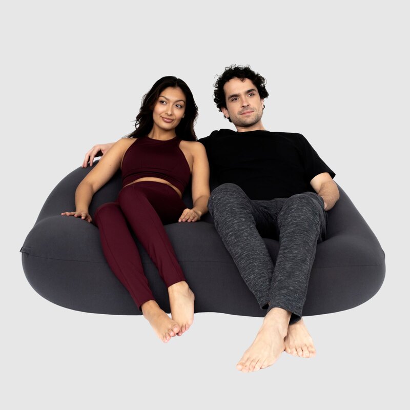 Double Moon Pod – two adults sharing the Cosmic Ash lounge seat
