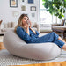 Moon Pod Bundle (Moon Pod + Backrest + Footrest) – Space Gray seat shown in a living room