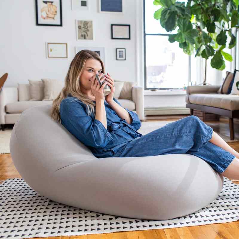 Moon Pod Bundle (Moon Pod + Backrest + Footrest) – Space Gray seat shown in a living room