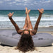 Outdoor Moon Pod – adult relaxing on the covered seat on beach sand