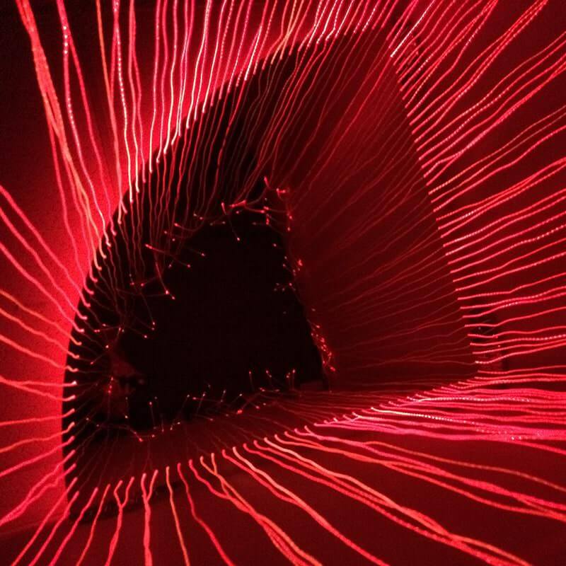 Inside view of the Experia Fiber Optic Sensory Light Corner Shower glowing red