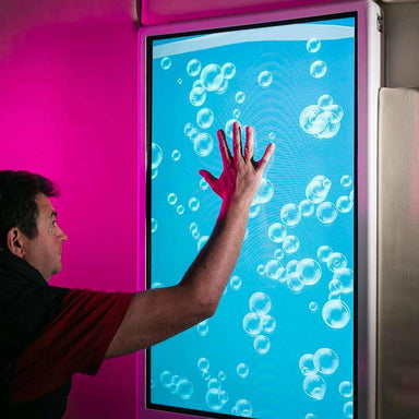 Experia IntelliTouch Bubble Wall Panel – user touching blue bubble display