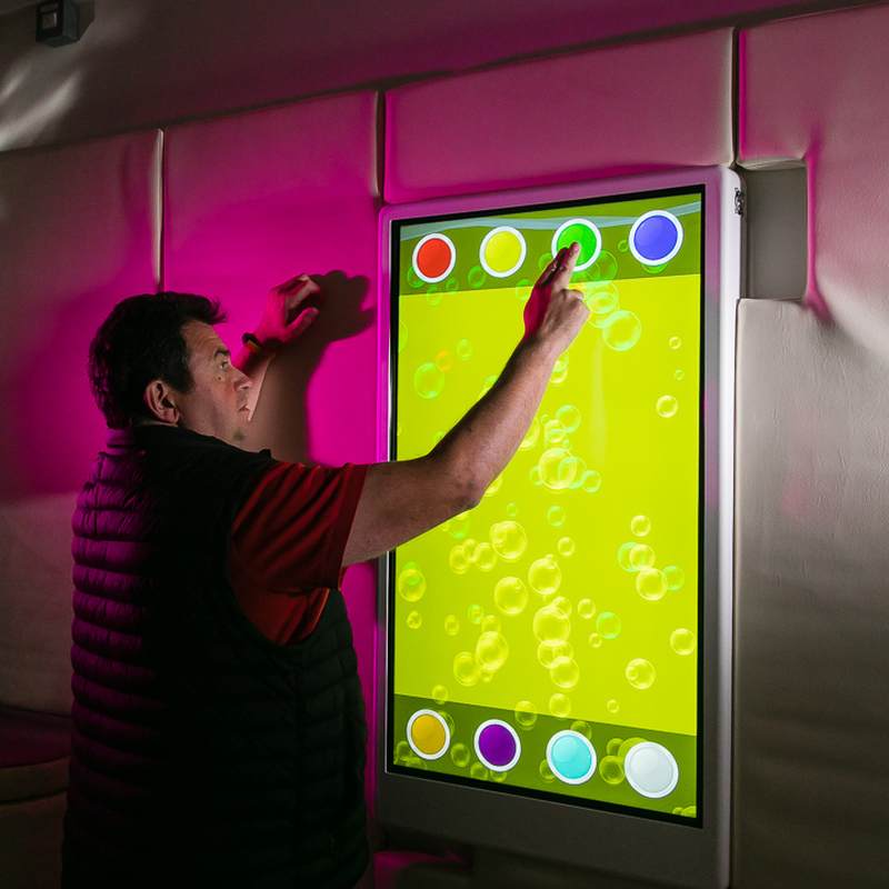 Experia IntelliTouch Bubble Wall Panel – user selecting interactive controls