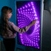 Experia IntelliTouch Infinity Panel – user touching purple infinity display