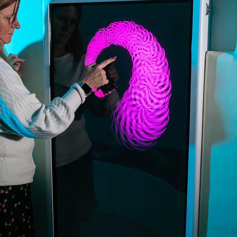 Experia IntelliTouch Musical Touch Panel – user creating pink interactive pattern