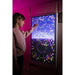 Child tracing colorful light particles on the Experia IntelliTouch Particle Panel