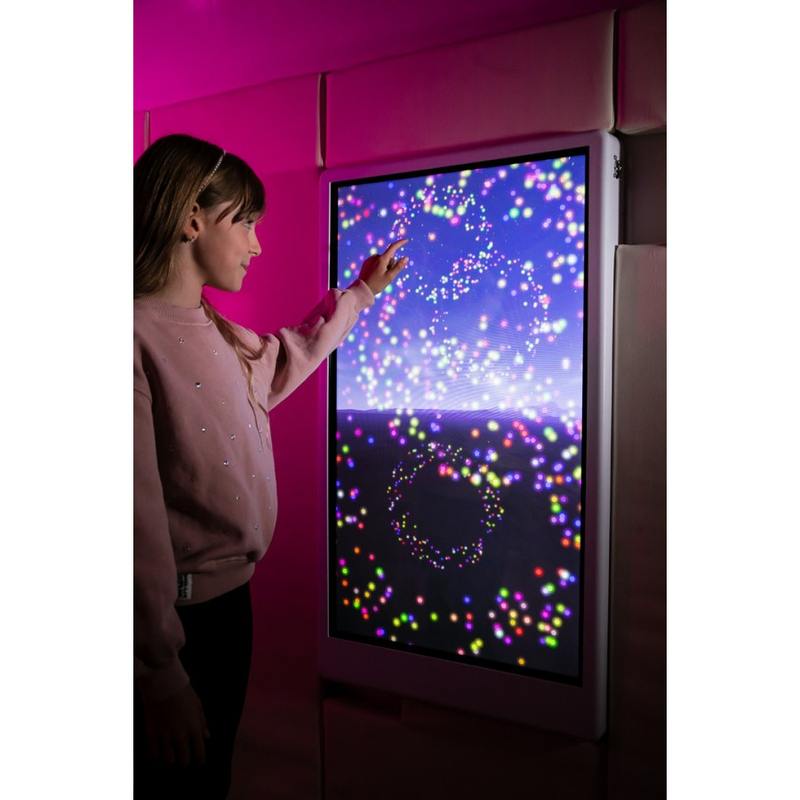 Child tracing colorful light particles on the Experia IntelliTouch Particle Panel