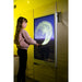 Child drawing a curved yellow particle trail on the Experia IntelliTouch Particle Panel