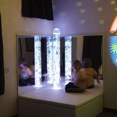Children using the Experia Interactive LED Bubble Tube Corner with white platform
