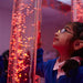 Child using the touch controls on the Experia Touch Sensitive LED Bubble Tube