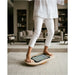 Flexyboard™ – adult balancing barefoot with a tablet