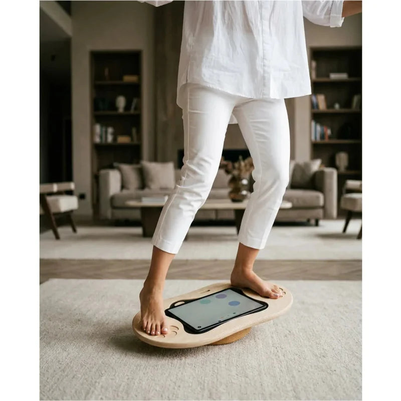 Flexyboard™ – adult balancing barefoot with a tablet