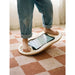 Flexyboard™ – child balancing barefoot on a board on carpet