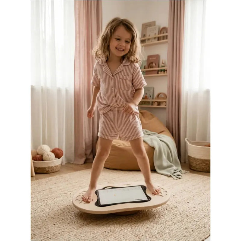 Flexyboard™ – girl balancing with a tablet in a home play space