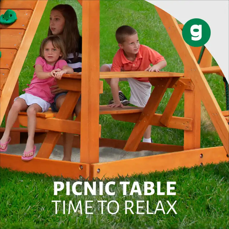Gorilla Playsets Empire Swing Set – children sitting at the built-in picnic table