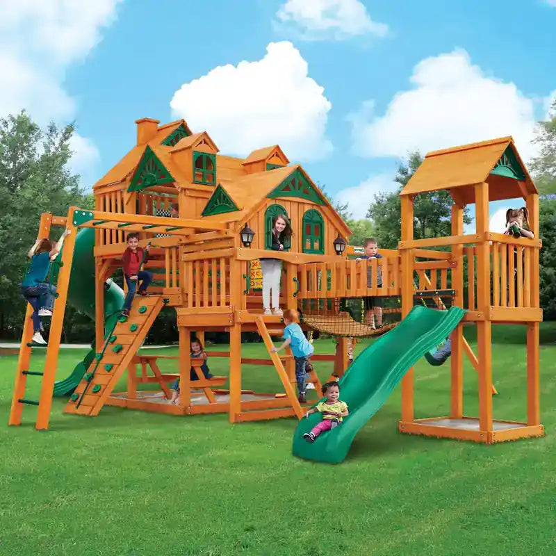 Gorilla Playsets Everest Elite Swing Set – kids playing on the bridge and two-slide clubhouse