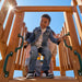 Gorilla Playsets Summerville Deluxe Swing Set – child at the clubhouse entrance with safety handles