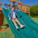Gorilla Playsets Summerville Deluxe Swing Set – child riding an Alpine Wave Slide