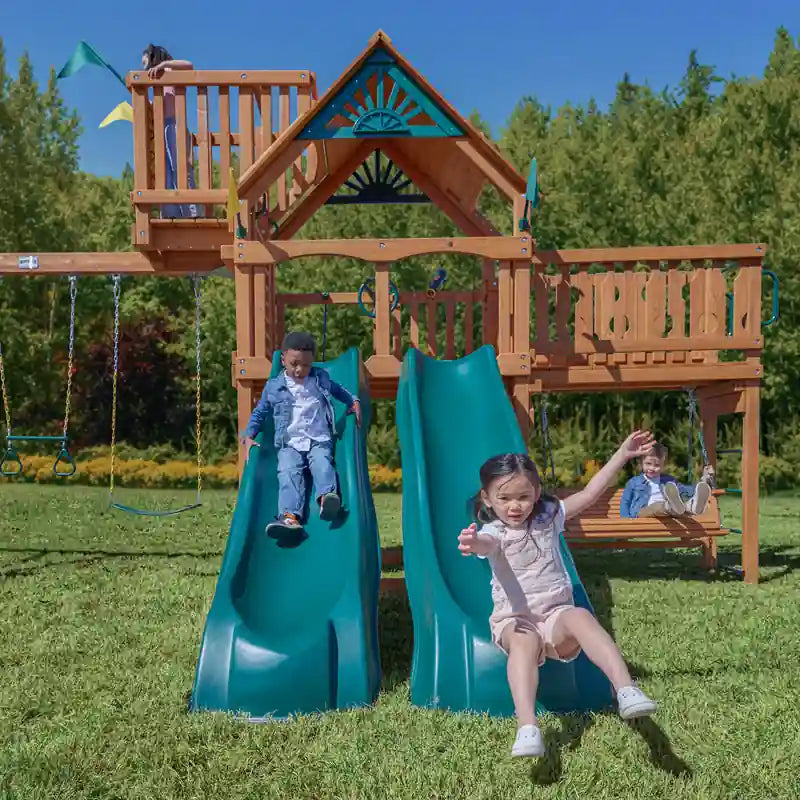 Gorilla Playsets Summerville Deluxe Swing Set – children riding the two side-by-side slides