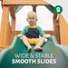 Gorilla Playsets Summerville Swing Set – child sitting at the top of the Alpine Wave Slide