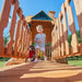 Gorilla Playsets Summerville Swing Set – child walking along the upper play deck