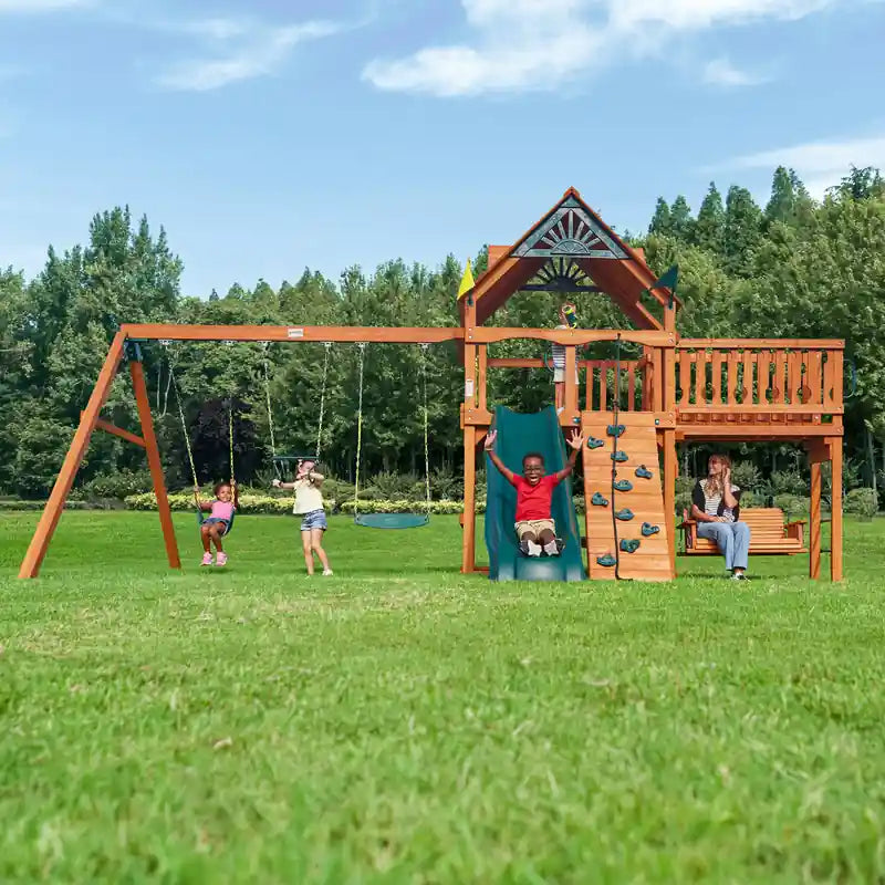 Gorilla Playsets Summerville Swing Set – children playing on the slide and swings in the yard
