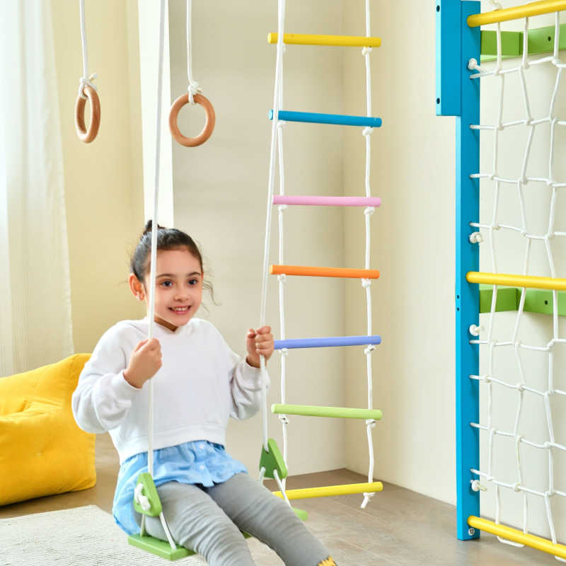 Grove Rainbow Foldable Indoor Jungle Gym playroom with child on swing