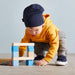 HABA Colored Wooden Building Blocks - 46 Piece Set – child creating a wooden block structure