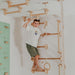 Home Monkey Bars – kid climbing a vertical wall-bar arrangement