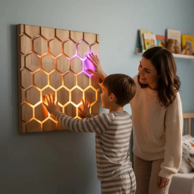 Honeycomb Touch Interactive Panel - child and adult touching the light up honeycomb wall panel