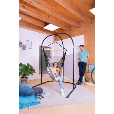 Arcada Anthracite - Galvanized Steel Stand for Hammock Chairs and Kids Hanging Nests – stand with mesh supporting a teen in a separately sold hammock chair with an adult reading nearby