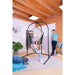 Arcada Anthracite - Galvanized Steel Stand for Hammock Chairs and Kids Hanging Nests – stand with mesh supporting a teen in a separately sold hammock chair with an adult reading nearby