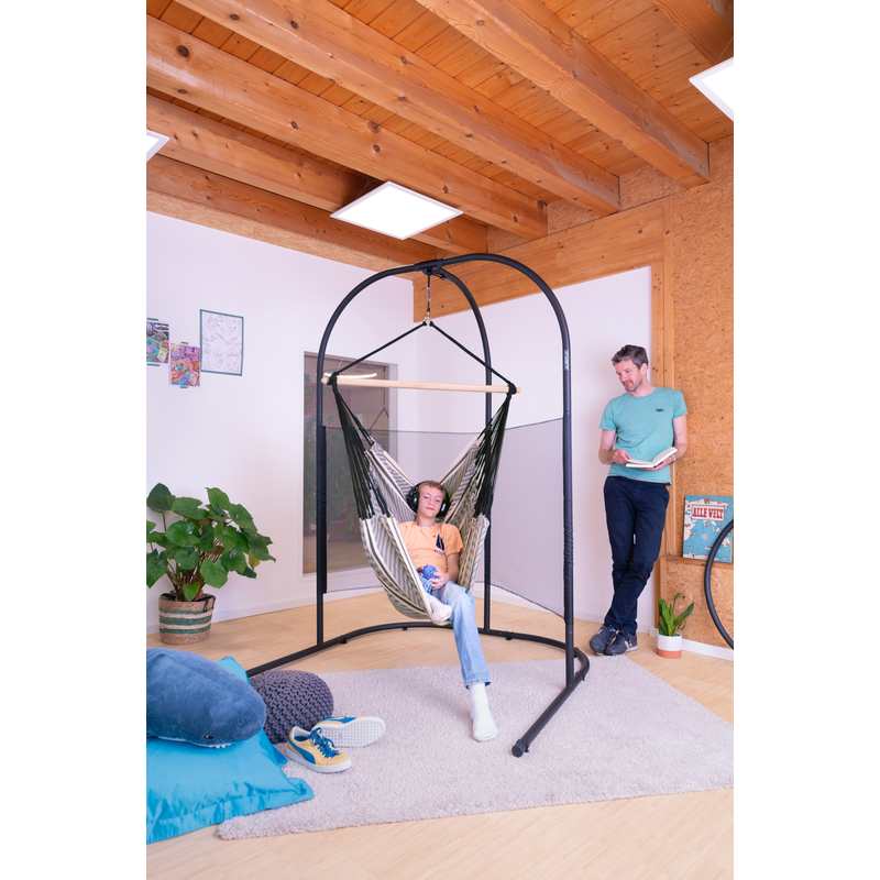 Arcada Anthracite - Galvanized Steel Stand for Hammock Chairs and Kids Hanging Nests – stand with mesh supporting a teen in a separately sold hammock chair with an adult reading nearby