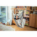 Domingo Sea Salt - Weather-Resistant Basic Hammock Chair – person relaxing beside a bookshelf