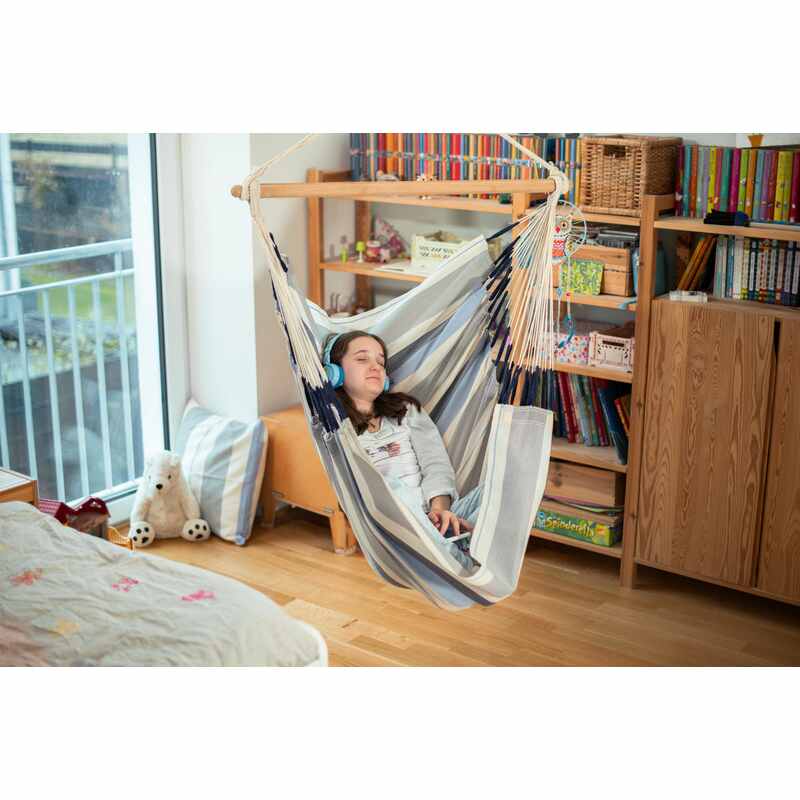Domingo Sea Salt - Weather-Resistant Basic Hammock Chair – person relaxing beside a bookshelf