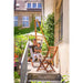 Domingo Sea Salt - Weather-Resistant Basic Hammock Chair – person seated on a balcony with a separate stand