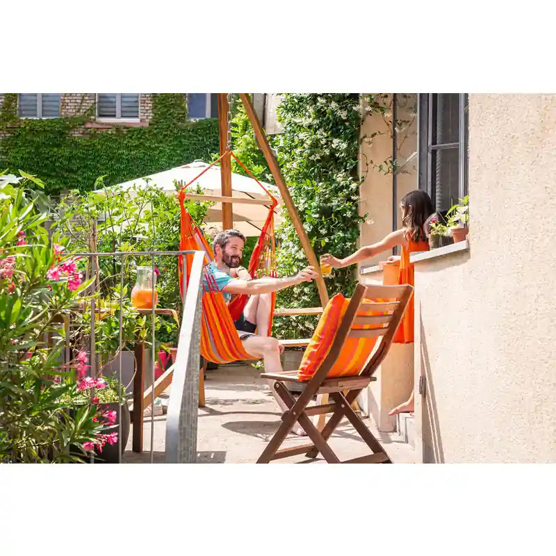 Domingo Toucan - Weather-Resistant Basic Hammock Chair – seated user on a balcony