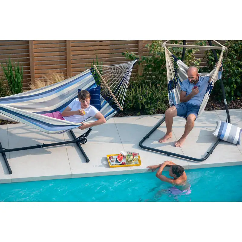 Domingo Sea Salt - Weather-Resistant Comfort Hammock Chair – family beside a pool with separate stands
