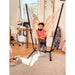 Fiji Organic Latte – Organic Cotton Basic Size Hammock Chair with Galvanized Steel Stand – kid seated in a sunny bedroom