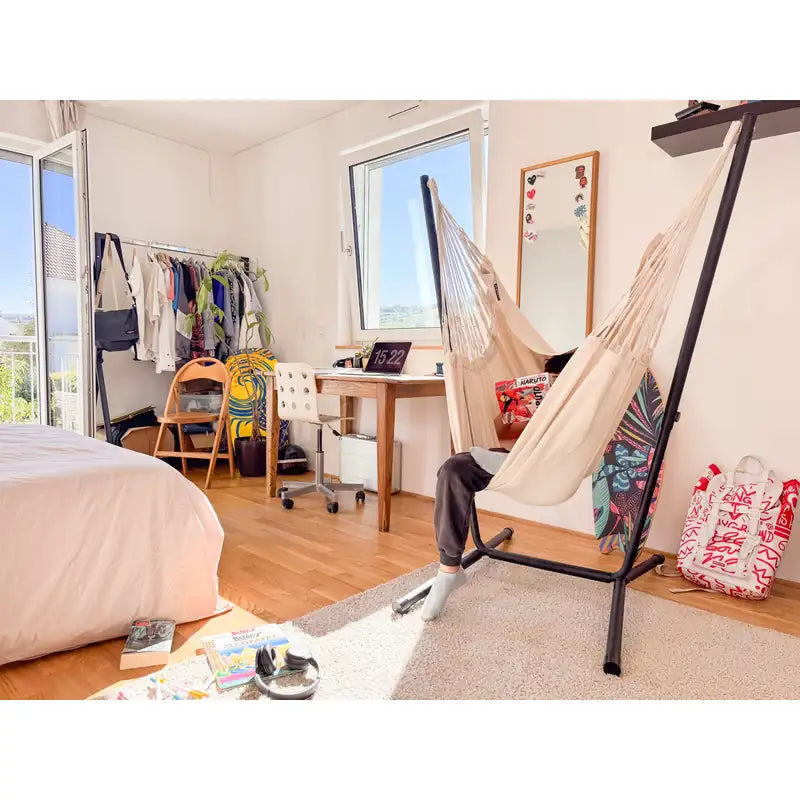 Fiji Organic Latte – Organic Cotton Basic Size Hammock Chair with Galvanized Steel Stand – side view of a seated kid