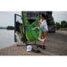 Fiji Outdoor Lime – Weather-Resistant Basic Size Hammock Chair with Galvanized Steel Stand – person seated beside a waterfront