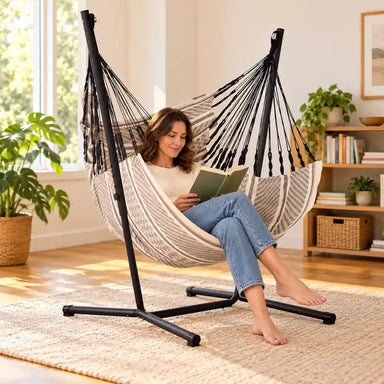 Fiji Organic Zebra – Organic Cotton Comfort Size Hammock Chair with Galvanized Steel Stand – lifestyle illustration of adult reading in the hammock chair in a family reading room
