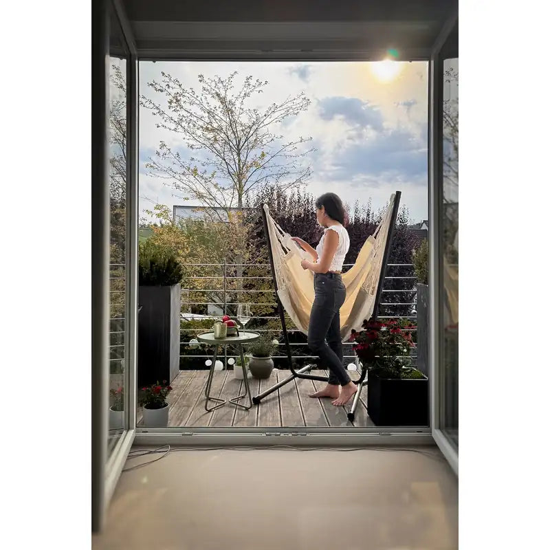Fiji Organic Latte – Organic Cotton Comfort Size Hammock Chair with Galvanized Steel Stand – chair viewed through a balcony doorway