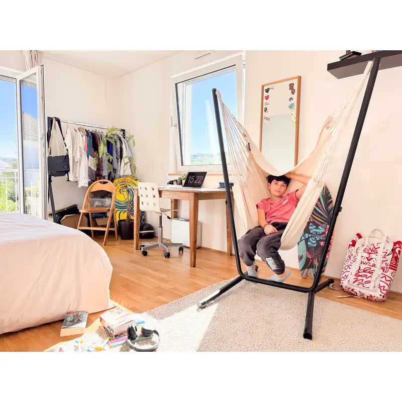 Fiji Organic Latte – Organic Cotton Comfort Size Hammock Chair with Galvanized Steel Stand – kid seated beside a bedroom desk