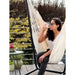Fiji Organic Latte – Organic Cotton Comfort Size Hammock Chair with Galvanized Steel Stand – person seated on a balcony